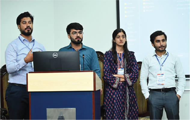 Students presenting on stage